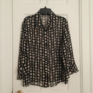 Polka dot, sheer blouse with 3/4 flouncy sleeves.